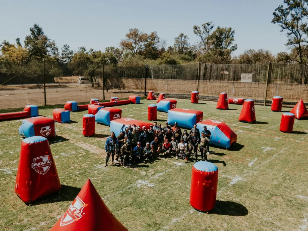 Group of adults playing paintball on an inflatable field in León, Mexico.