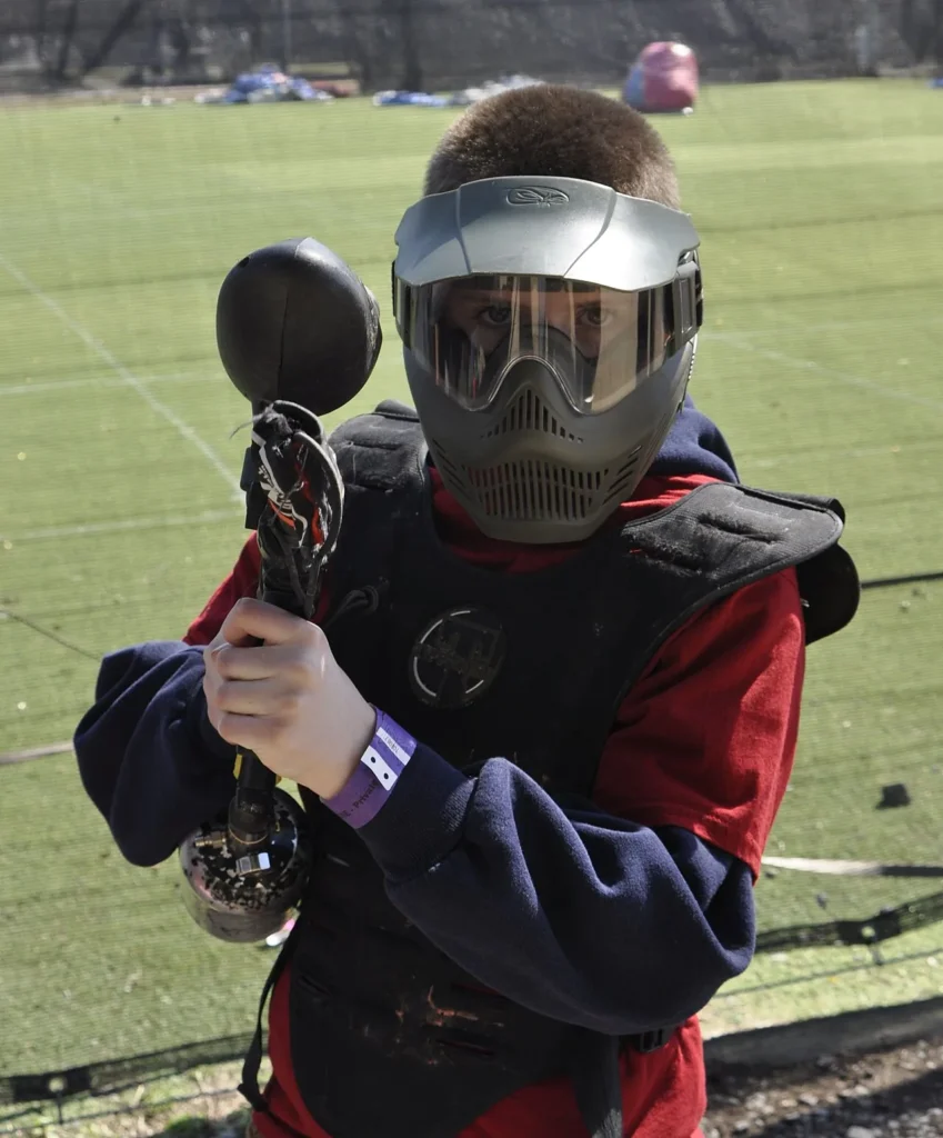 Paintball player wearing a full-face mask